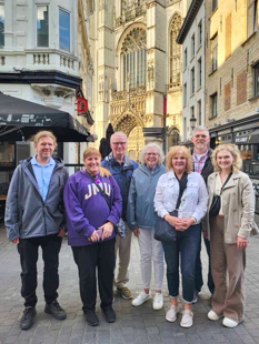 Liz Heavner smiling for a photo with a group of staff/faculty 
