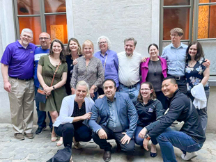 Liz Heavner with colleagues smile for a group photo