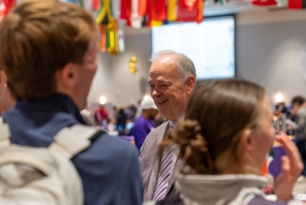 President Jim at the Study Abroad Fair with students.