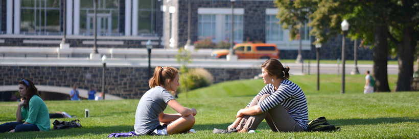 JMU students sitting on the quad