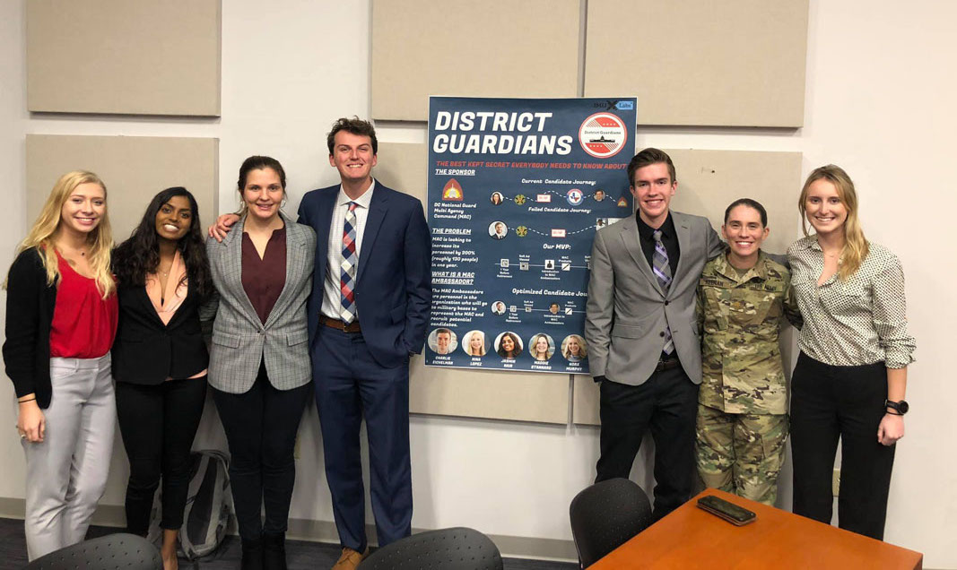 Major Laura Keenan from the D.C. National Guard visits JMU to watch the students present their solution.