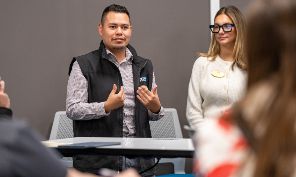 Photo of student presenting at Solutions Showcase. 
