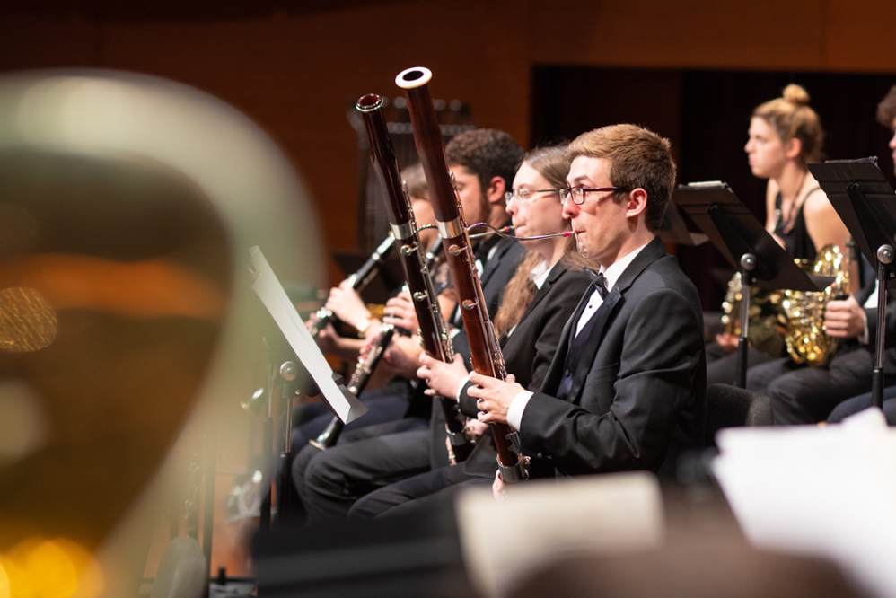 Bassoonist playing in wind ensemble