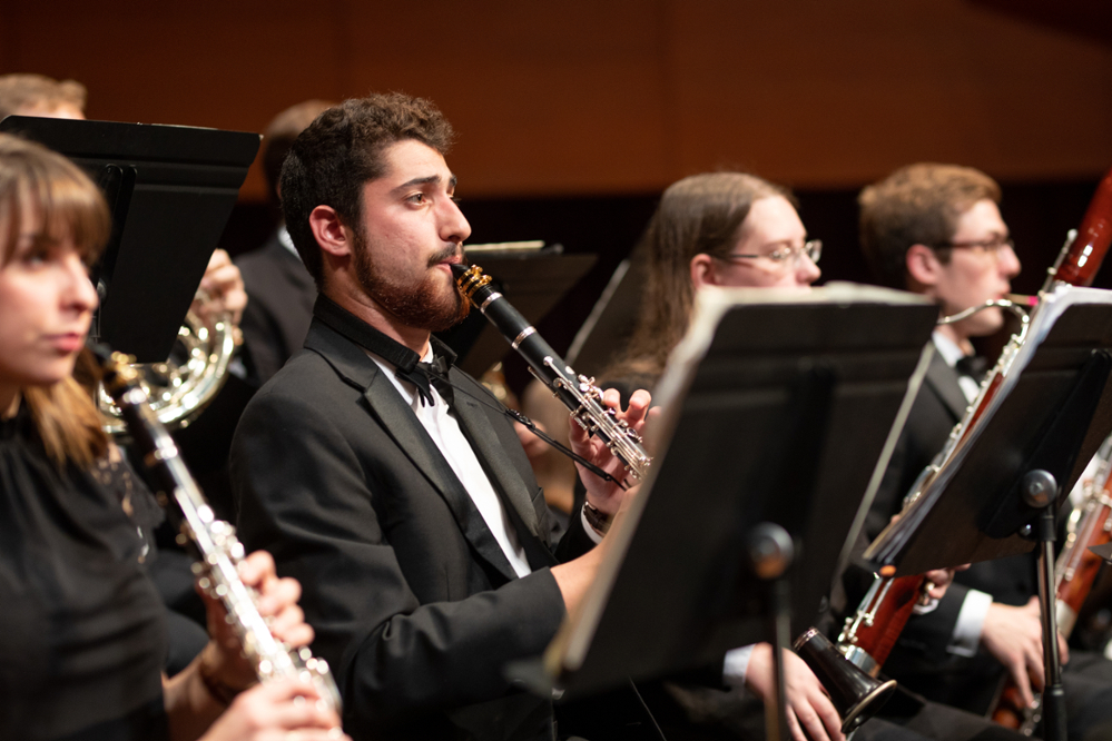 Clarinetist performing with wind band
