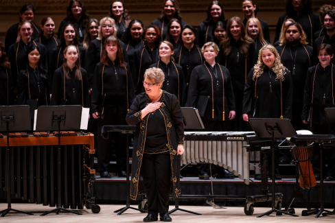 conductor thanking the audience from stage
