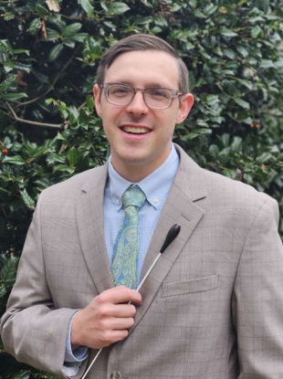 Man holding a conducting baton