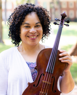 woman smiling holding a viola