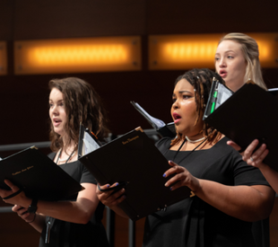 Chorus members singing