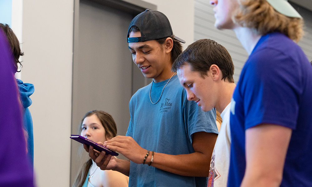 Students looks at Constitution books.