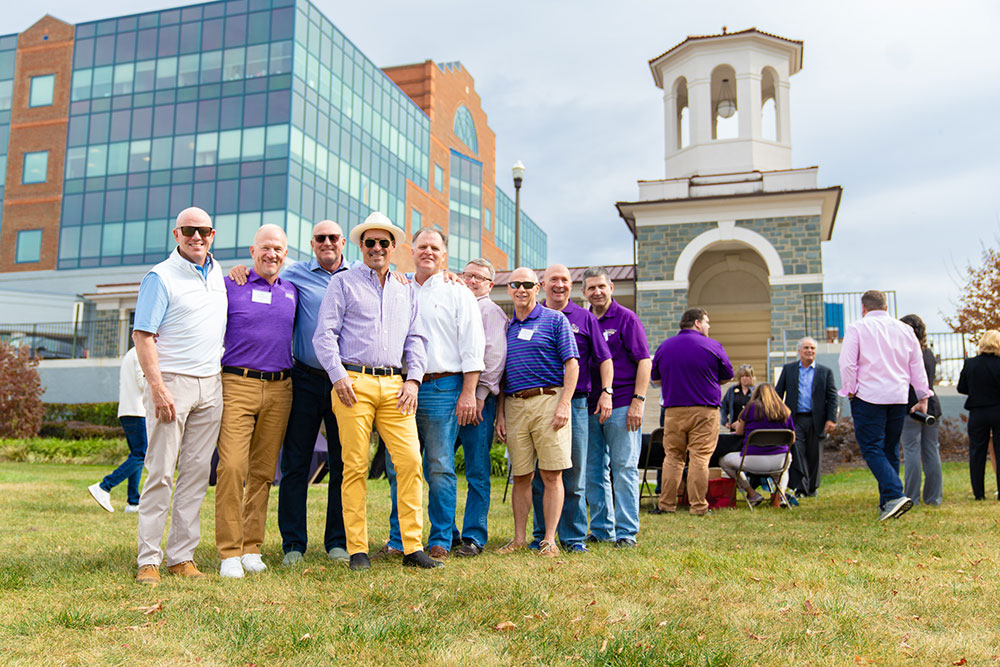 Paul Holland in a group of his Sigma Nu fraternity brothers outside Holland Yates Hall