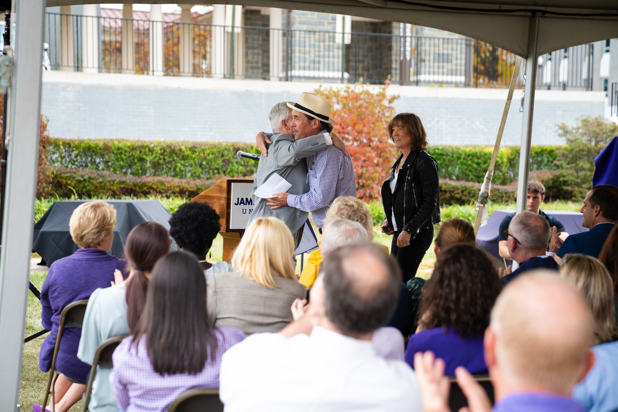 Jonathan Alger embraces Paul Holland