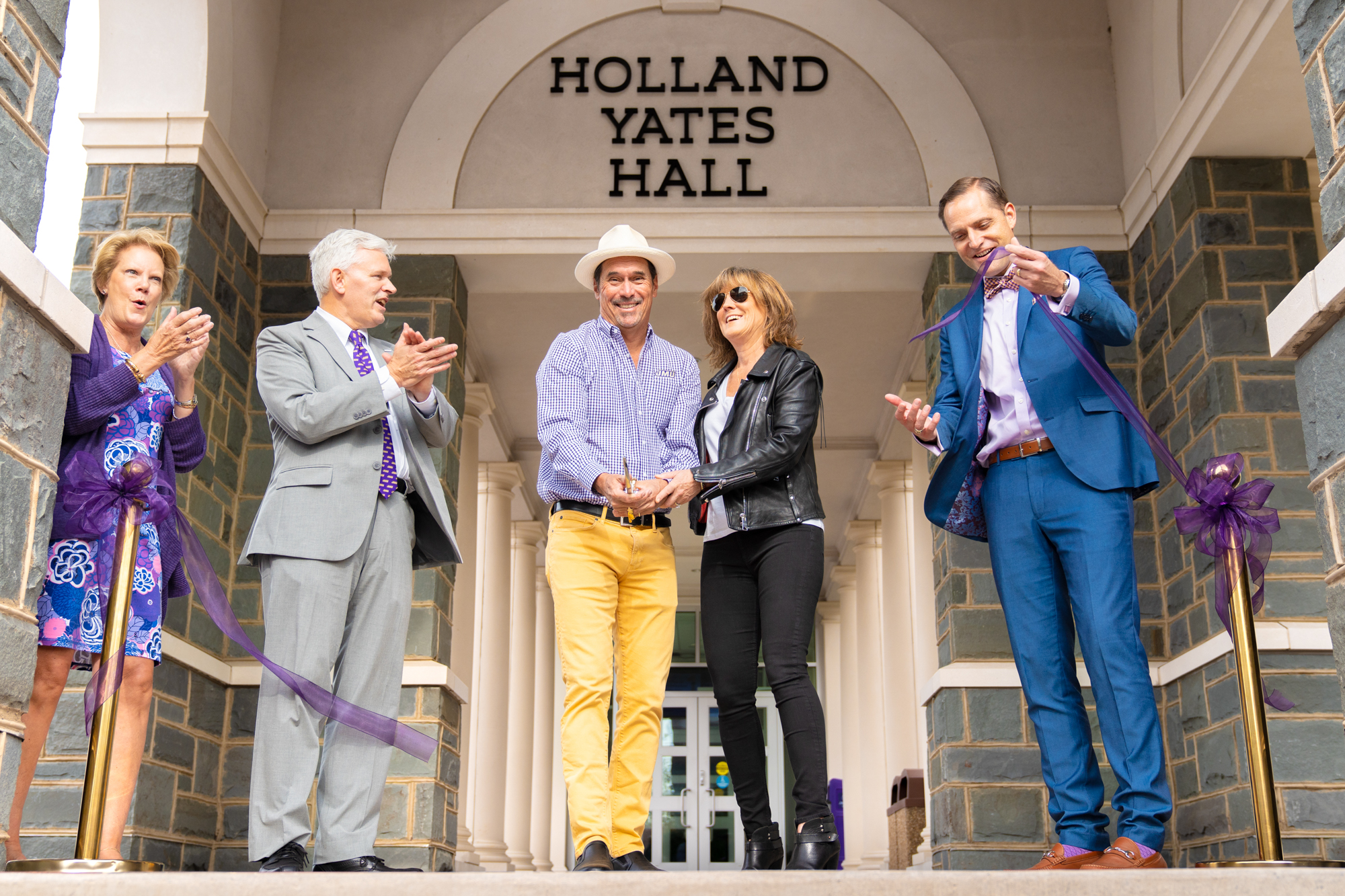 Paul Holland and Linda Yates officially cut the ribbon dedicating Holland Yates Hall