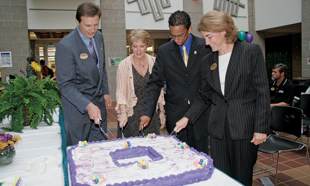 Donna Harper cutting a cake