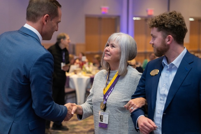 Alumna receiving medal