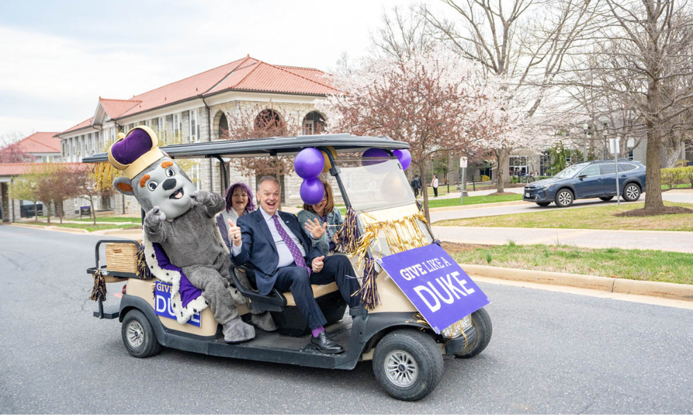 President Jim Schmidt in golf cart