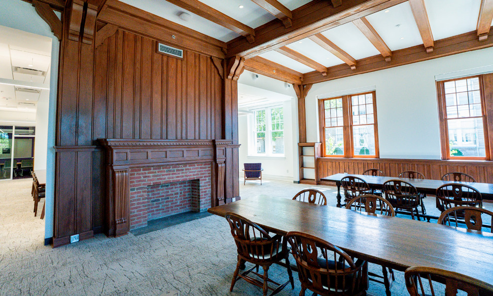 2026 view of the historic decorative fireplace and woodwork. 