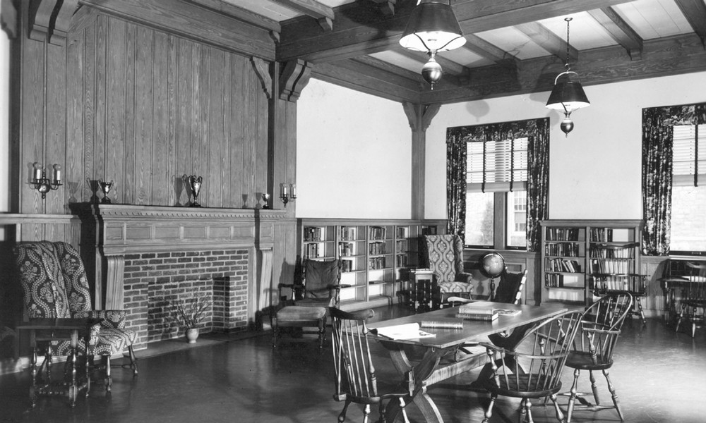 A 1940s view of the Hinshaw reading room featuring the historic decorative fireplace.