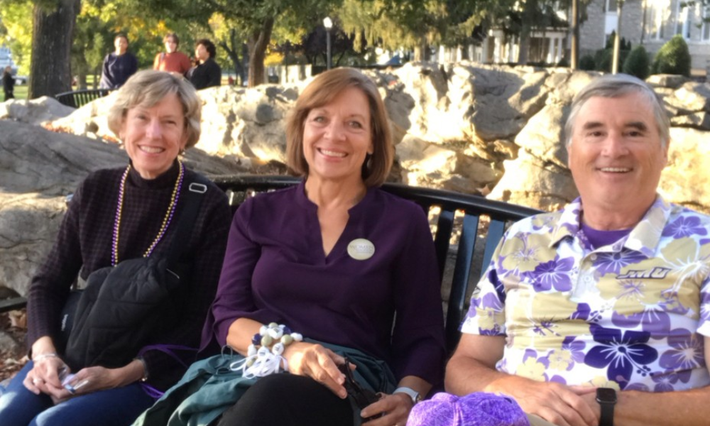 Hillgrove, his wife, and their alum friend on the quad