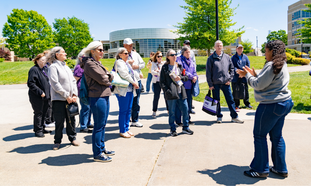 A group from the Reunion photographed candidly on a JMU tour
