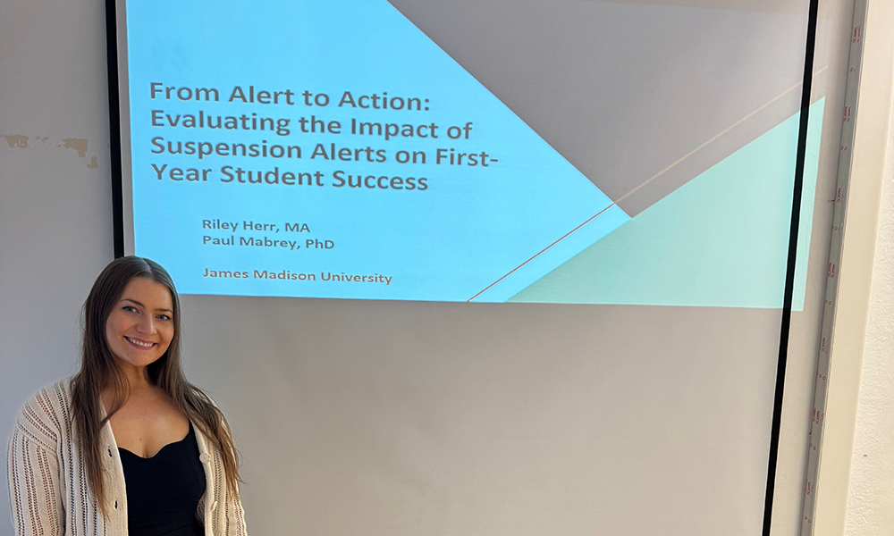 Riley Herr presents at the conference.