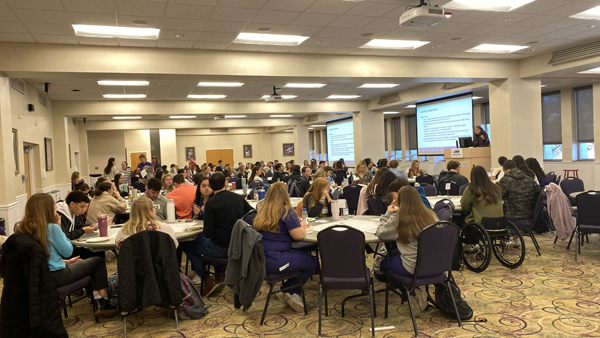 Students at tables during the 2023 Health Policy Summit at JMU