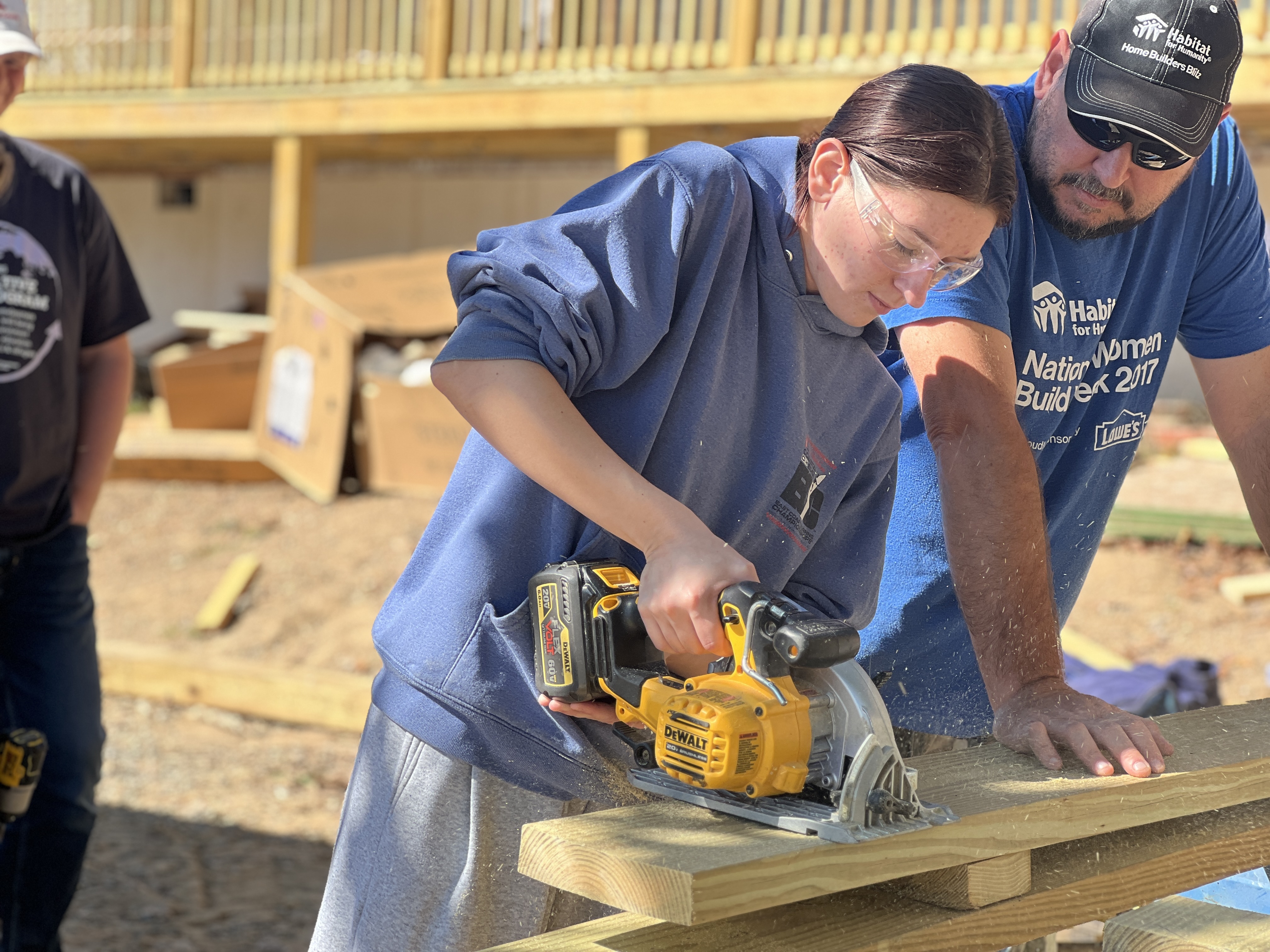 student using an electric saw