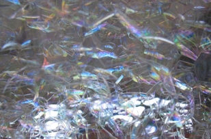 Close-up of soap bubbles inside a 2-liter bottle.