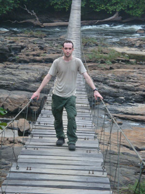 Josh Linder on a bridge in Korup National Park
