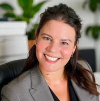 Jerilyn. Smiling woman with long dark hair. 