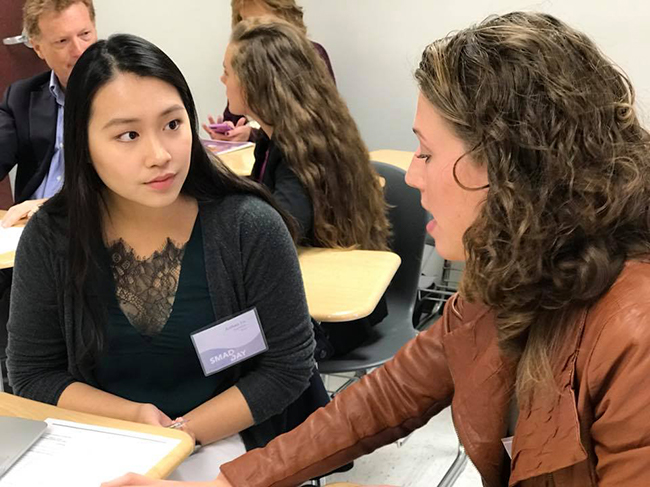 Students and Alum interact at the resume review