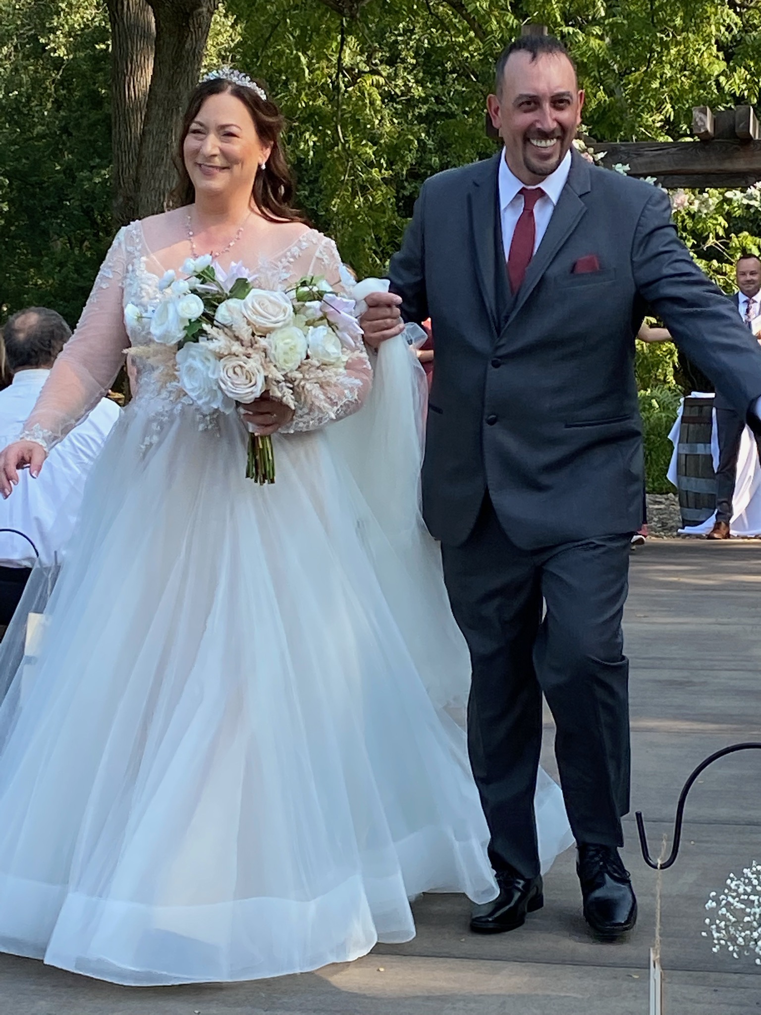Kim and Dennis on there wedding walking down the aisle