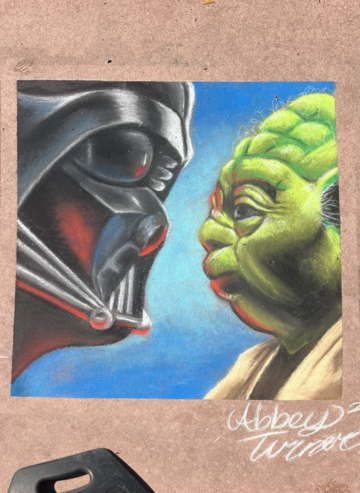 Chalk drawing of Darth Vader and Yoda facing each other in profile against a blue background.