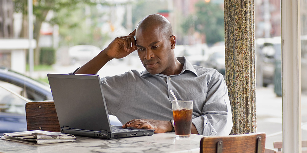 man-at-cafe-on-laptop.jpg