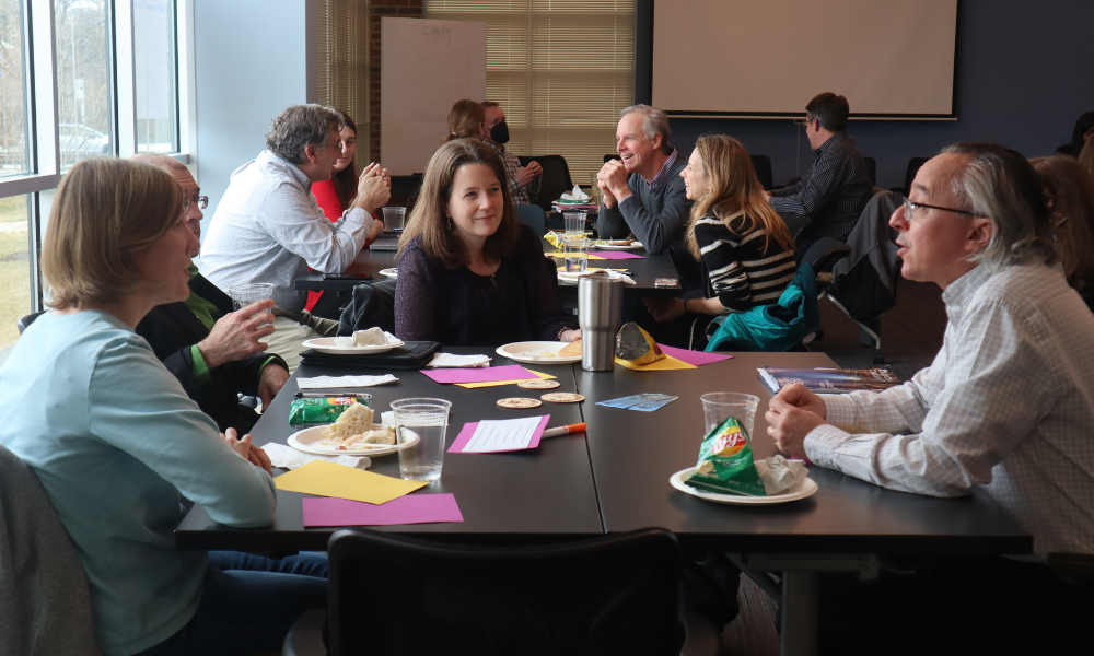 A group of JMU faculty engaged in conversation