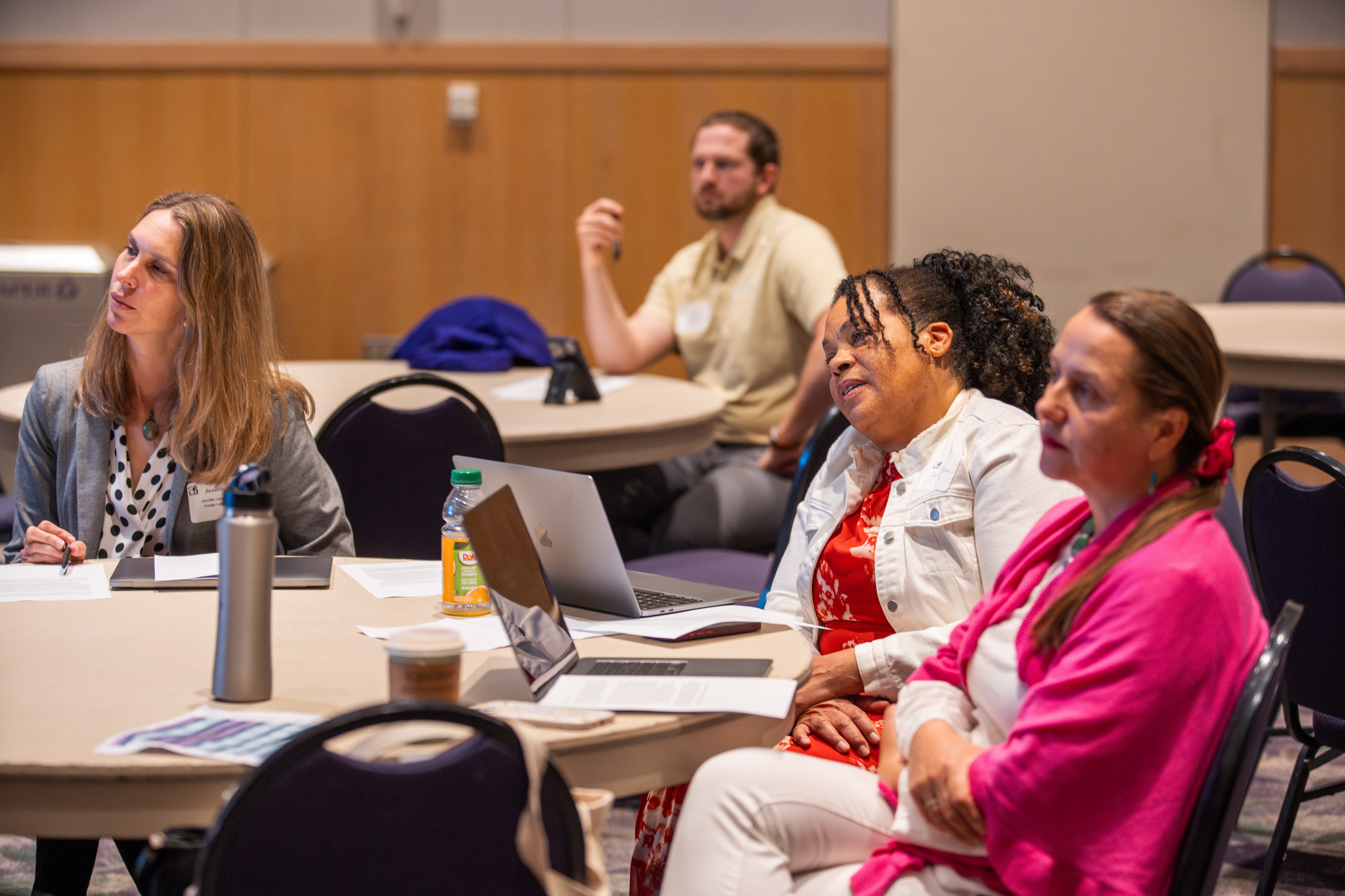 A group of attendees listening attentively during a conference or workshop.