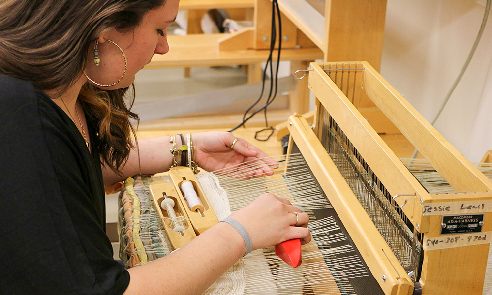 student at loom