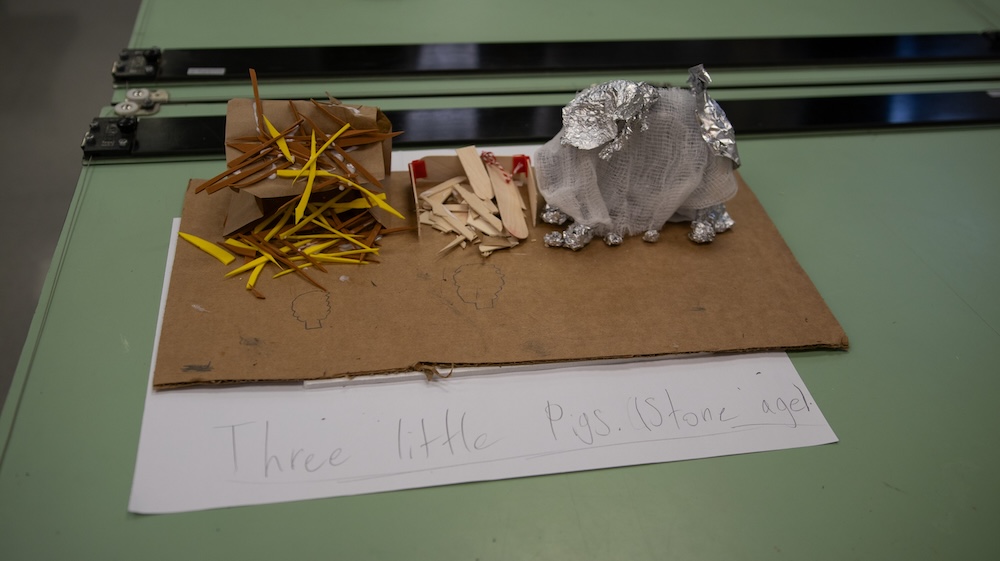 Three little pigs in the stone age