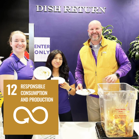University administrator participates in food waste activity with dining staff