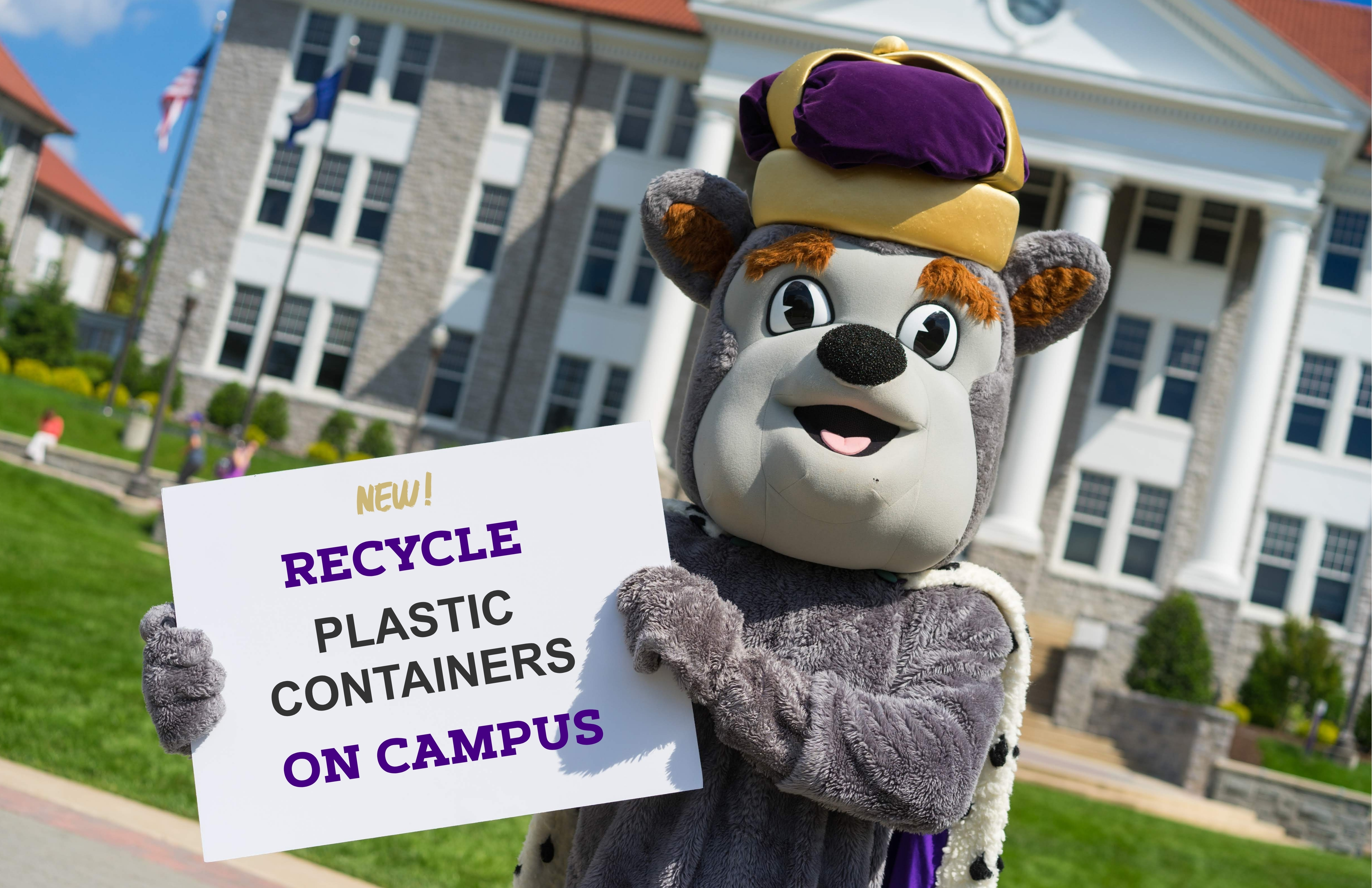 School mascot holding sign announcing plastic container recycling collection