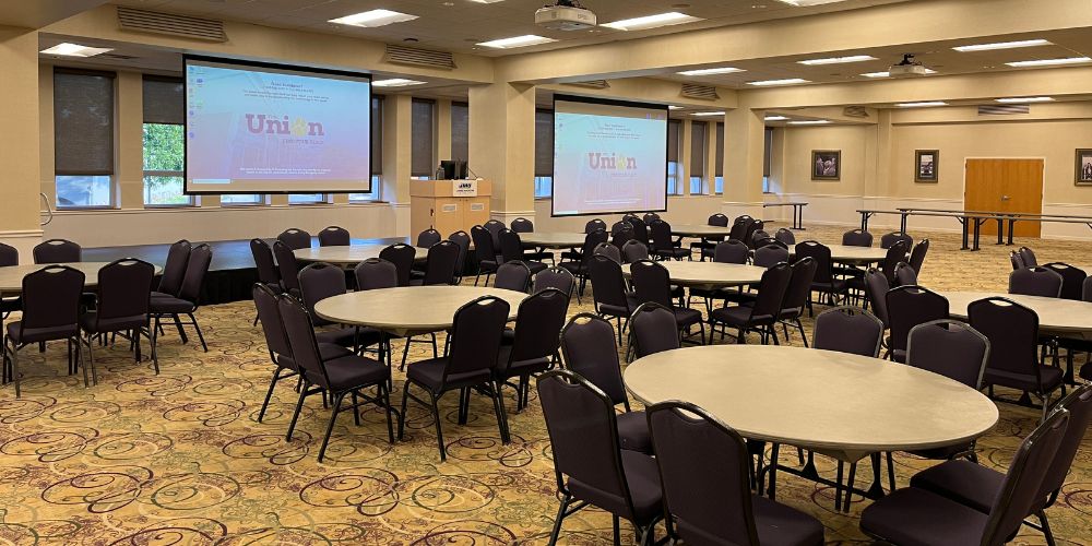 Union Ballroom from left rear of room in banquet style seating