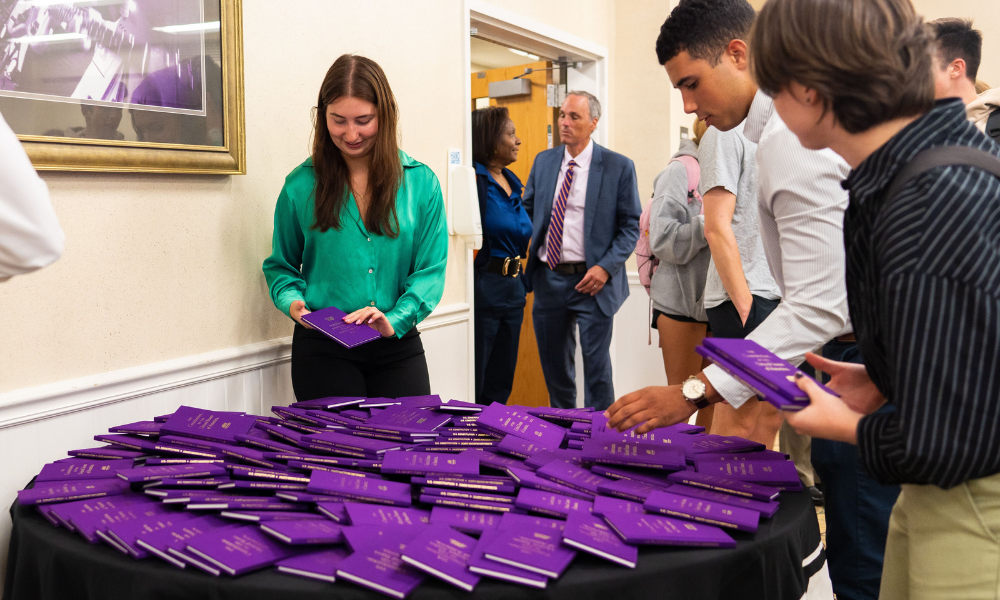 <span class="submesa"><span class="slidetitle">Constitution Day</span></span> fellows at constitution day with JMU purple constituions