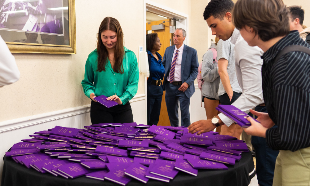 fellows at constitution day with JMU purple constituions